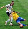 Cristiane of Brazil fights for the ball with Simone Laudehr of Germany